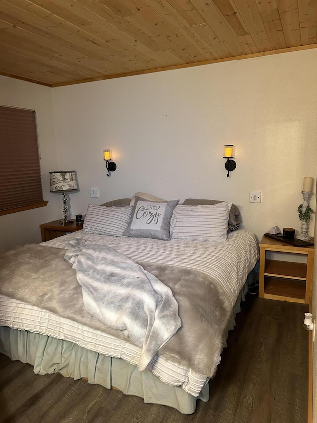 bedroom with ornamental molding, wood ceiling, and dark wood-type flooring