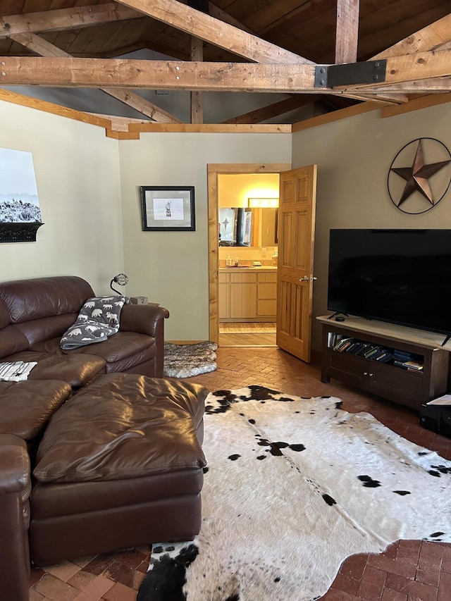 living room featuring wood ceiling and vaulted ceiling with beams