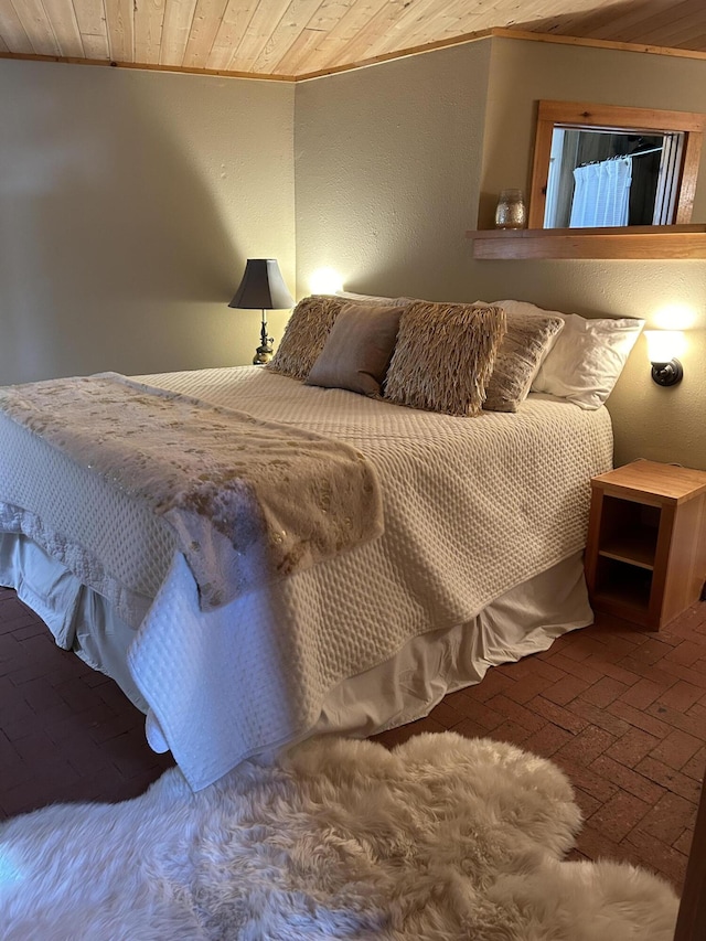 bedroom featuring wooden ceiling and crown molding