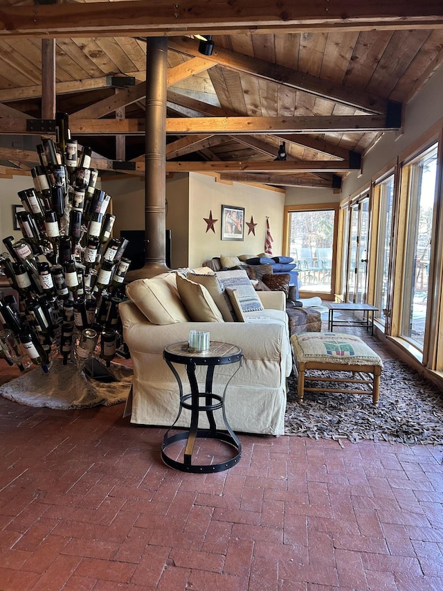 living room featuring lofted ceiling with beams and wooden ceiling