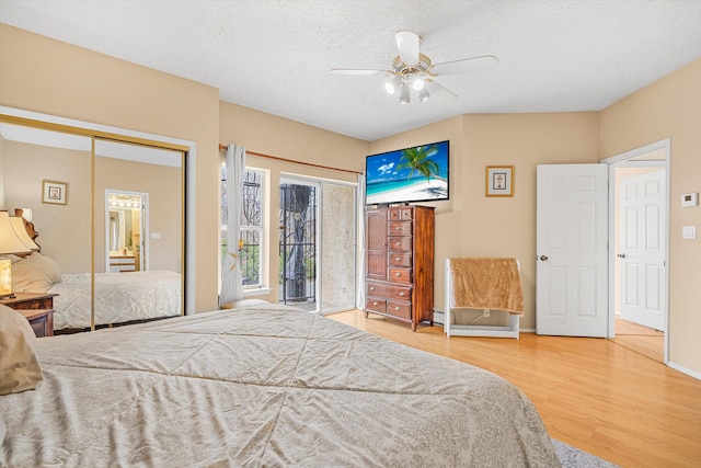 bedroom featuring hardwood / wood-style flooring, ceiling fan, a textured ceiling, and a closet