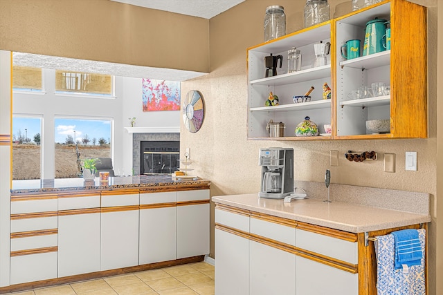 kitchen with white cabinetry and light tile patterned floors