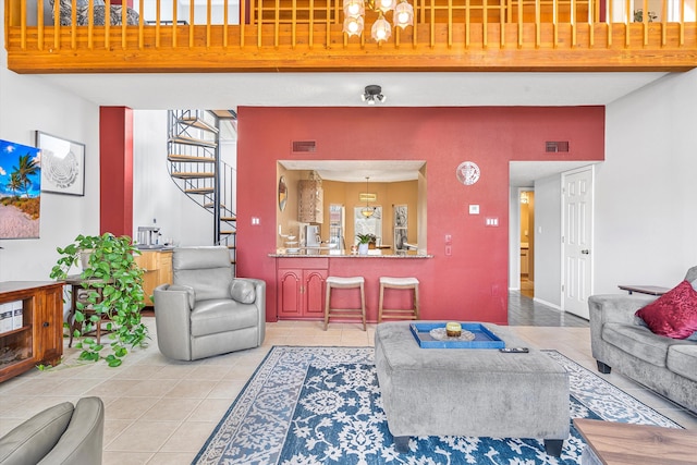 tiled living room with beamed ceiling