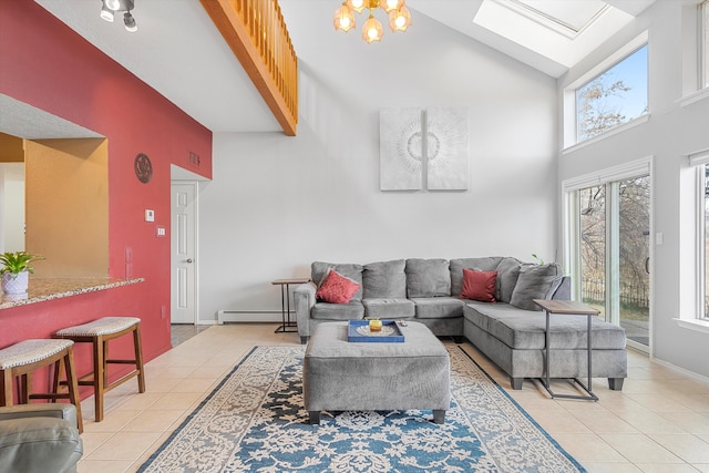 tiled living room featuring baseboard heating, a skylight, and high vaulted ceiling