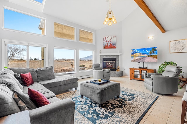 living room with light tile patterned flooring, high vaulted ceiling, a wealth of natural light, and a fireplace