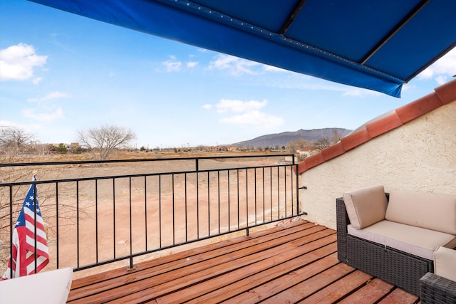 wooden terrace with a mountain view