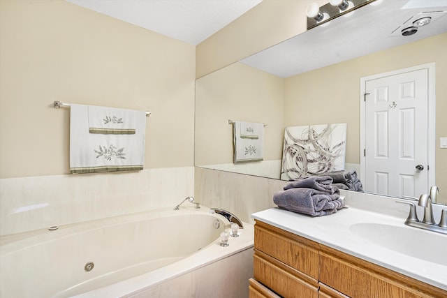 bathroom with vanity and a bathtub