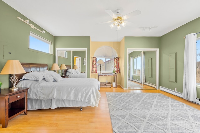 bedroom with hardwood / wood-style floors and ceiling fan