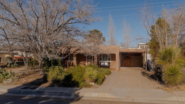 view of front facade with a carport