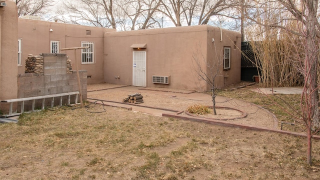 rear view of house with a patio