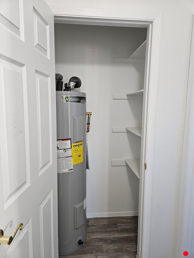 utility room featuring electric water heater