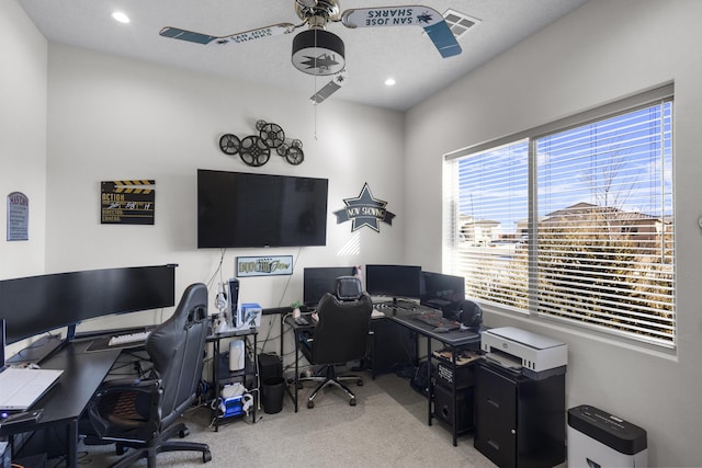 carpeted office space with recessed lighting, visible vents, and ceiling fan