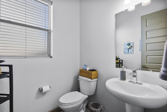 bathroom featuring sink and toilet