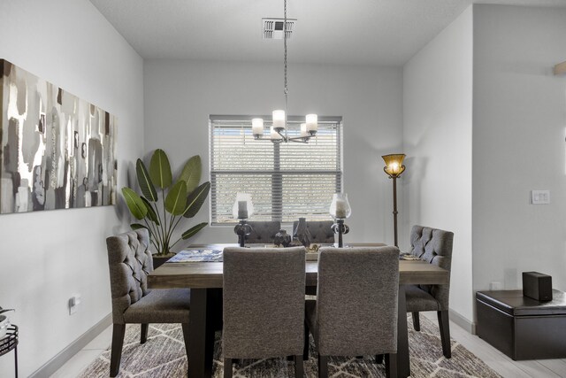 dining room with a chandelier