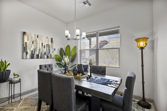 dining room featuring a notable chandelier