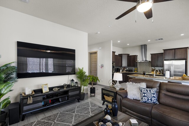 living room with ceiling fan