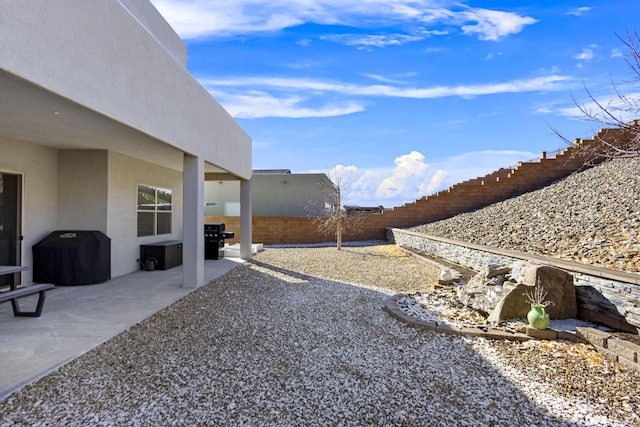 view of yard with a patio area and a fenced backyard