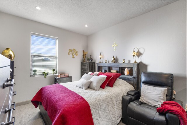 carpeted bedroom with a textured ceiling