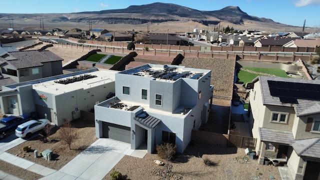 birds eye view of property featuring a mountain view