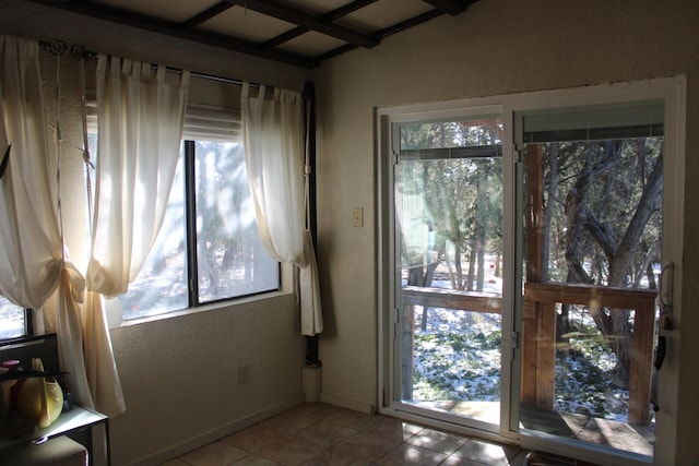 entryway featuring a healthy amount of sunlight and light tile patterned floors