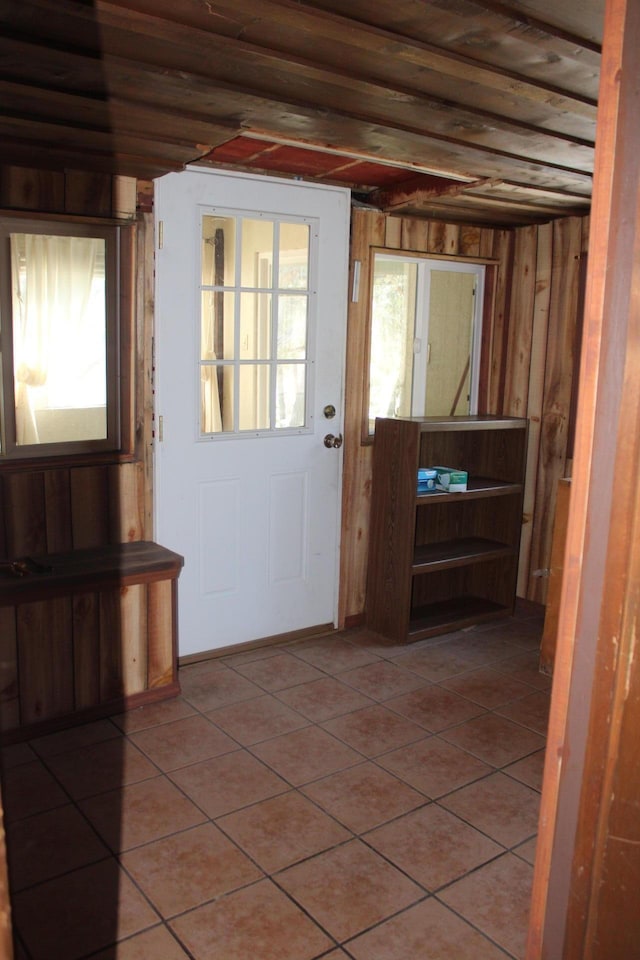 doorway with tile patterned floors