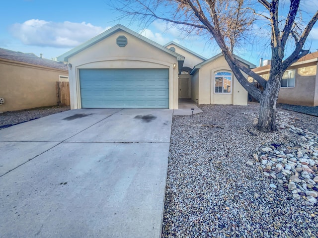 ranch-style house featuring a garage