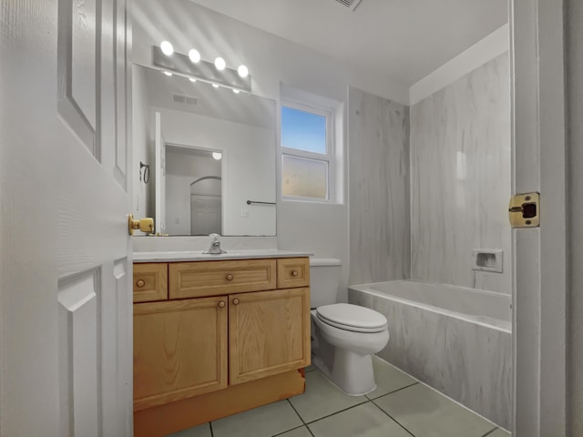 full bathroom with tile patterned floors, toilet, vanity, and tiled shower / bath