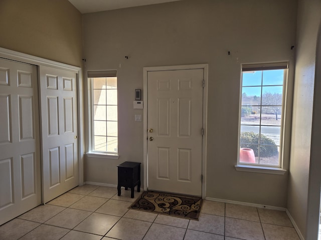 tiled foyer with a wealth of natural light