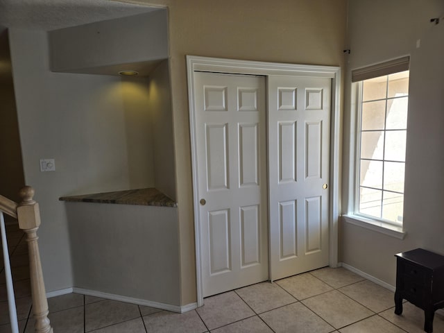 interior space with light tile patterned flooring