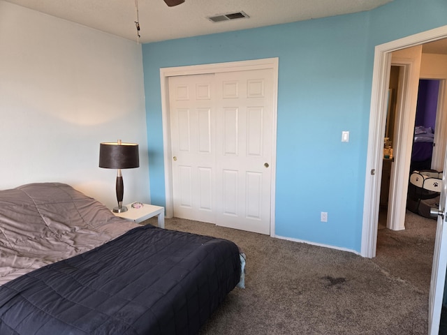 bedroom featuring a closet, ceiling fan, and carpet flooring