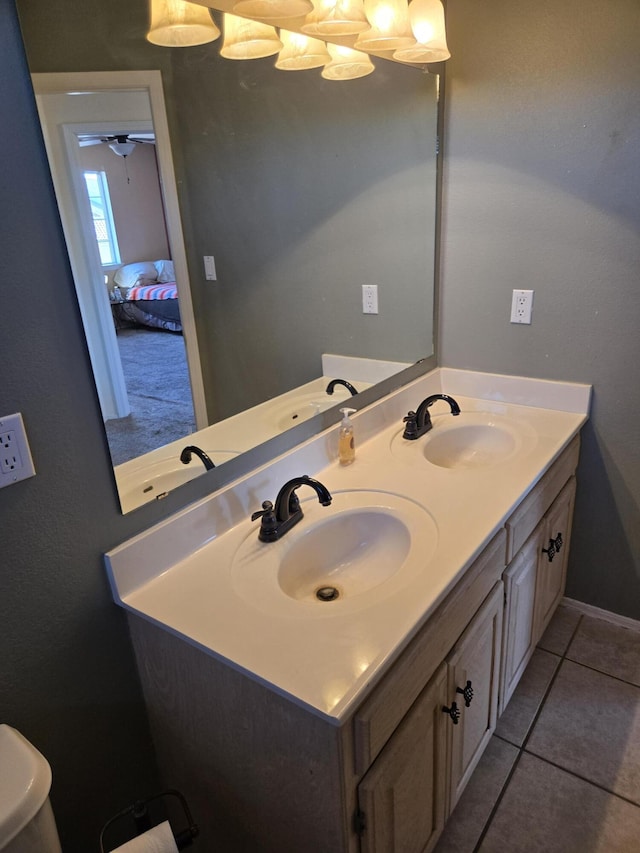 bathroom featuring vanity, ceiling fan, and tile patterned flooring