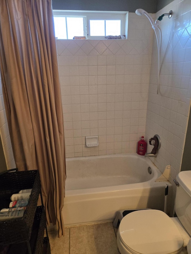 bathroom featuring toilet, tile patterned floors, and shower / tub combo with curtain