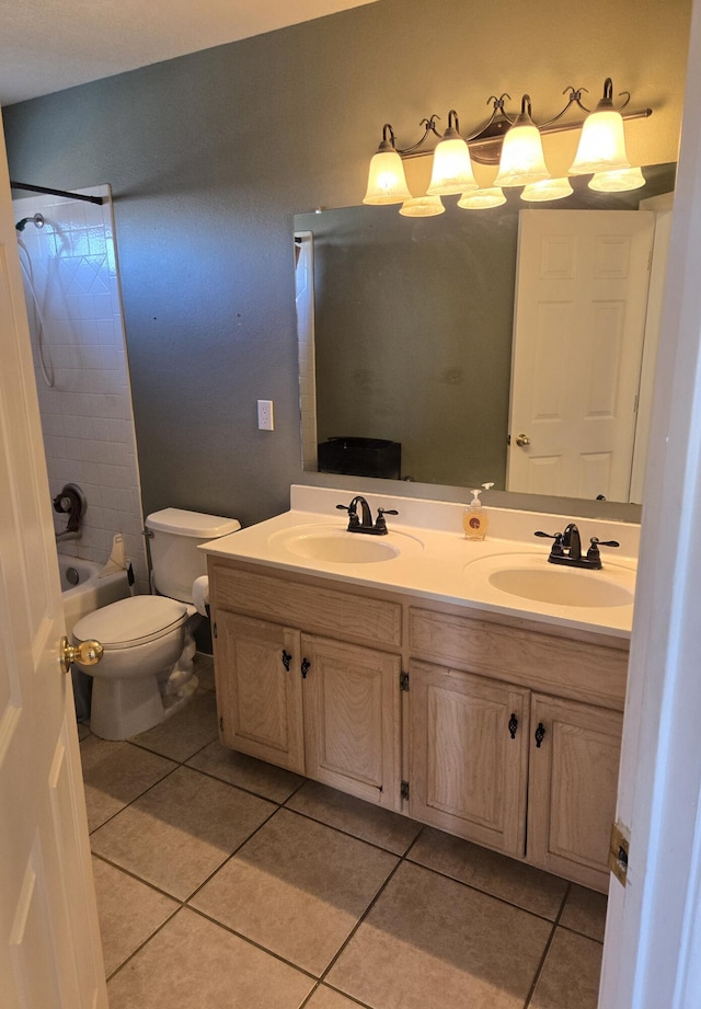 full bathroom with toilet, vanity,  shower combination, and tile patterned flooring