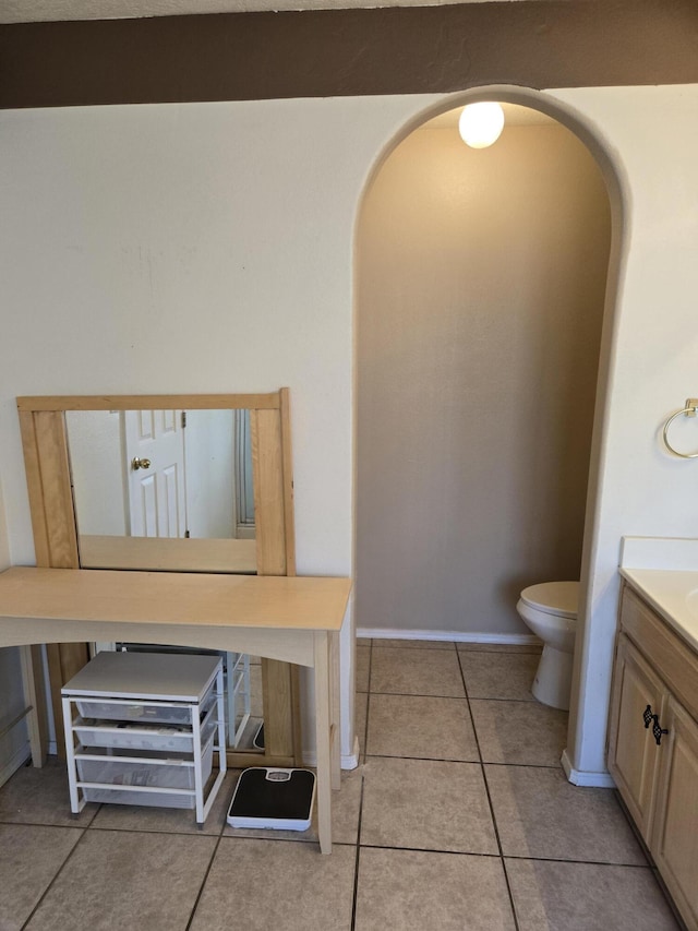 bathroom featuring vanity, toilet, and tile patterned floors