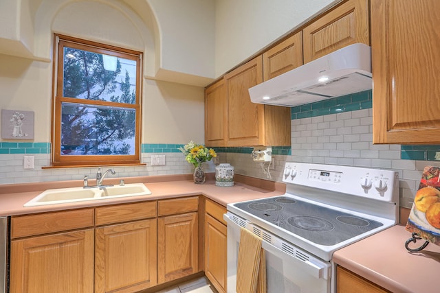 kitchen with sink, extractor fan, decorative backsplash, and white range with electric cooktop