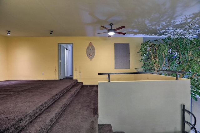 exterior space with ceiling fan