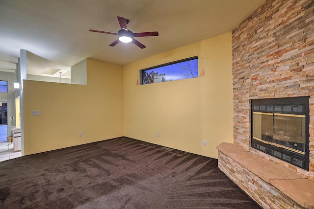 unfurnished living room featuring carpet, ceiling fan, and a fireplace