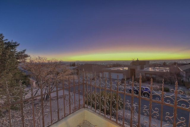 view of balcony at dusk