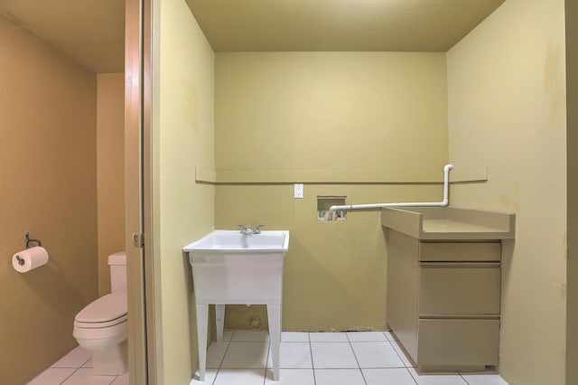 bathroom featuring toilet and tile patterned floors