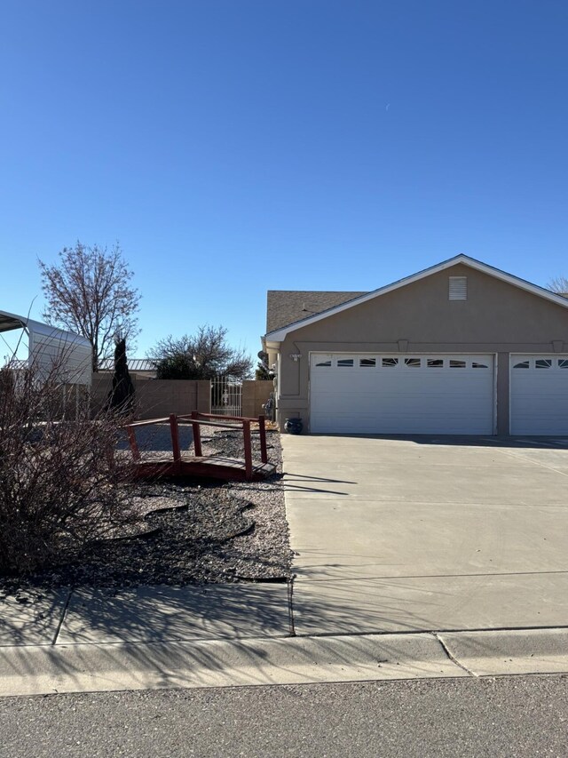 single story home with a garage