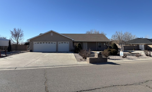 ranch-style house featuring a garage