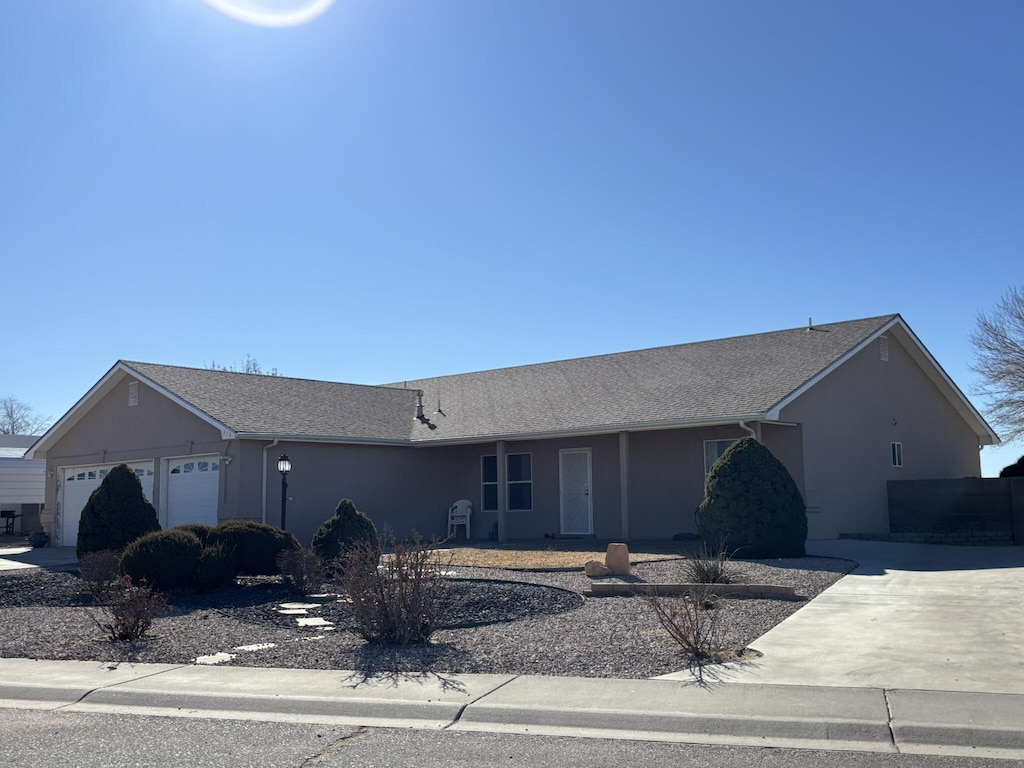 single story home featuring a garage