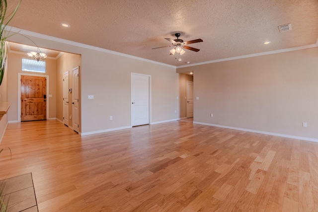 empty room with ceiling fan with notable chandelier, light wood-type flooring, crown molding, and a textured ceiling