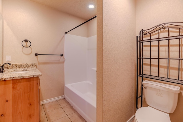 full bathroom featuring vanity, shower / bathing tub combination, a textured ceiling, tile patterned flooring, and toilet