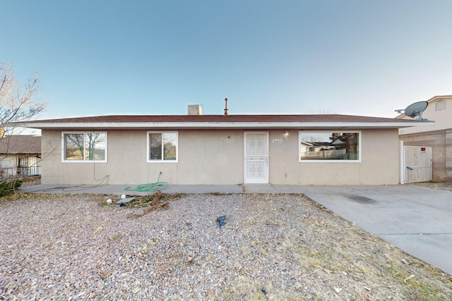 ranch-style home with a patio area