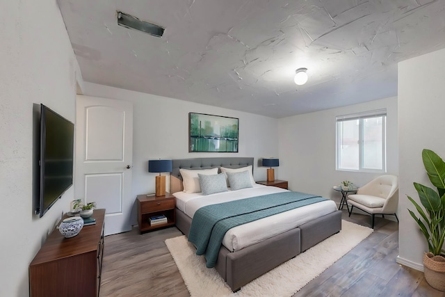 bedroom featuring hardwood / wood-style flooring