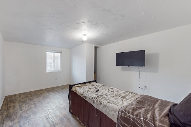 bedroom with wood-type flooring