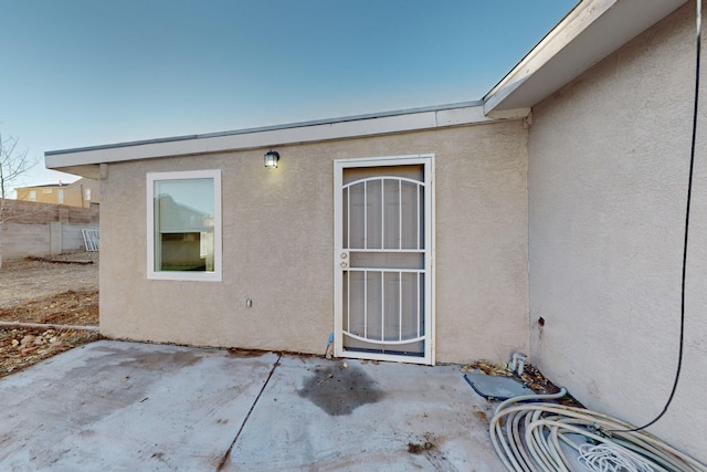 entrance to property with a patio area