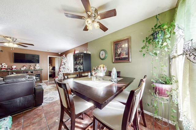 tiled dining room with ceiling fan