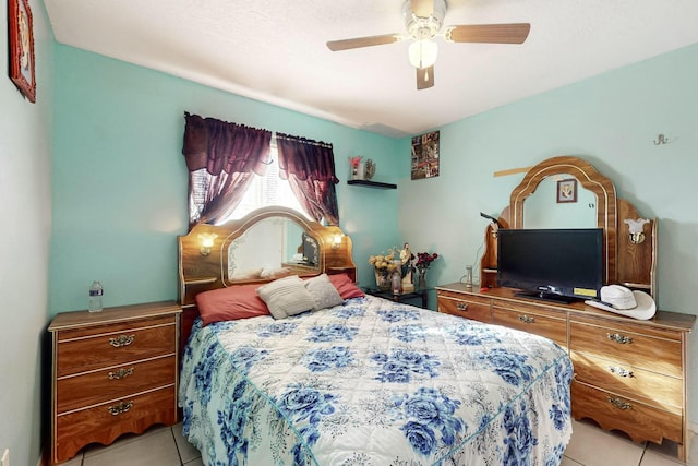 tiled bedroom with ceiling fan